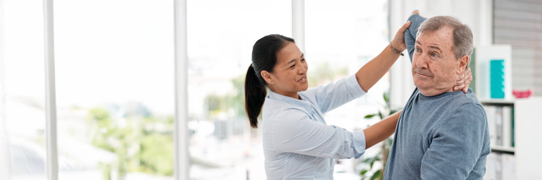 occupational therapist working with male patient